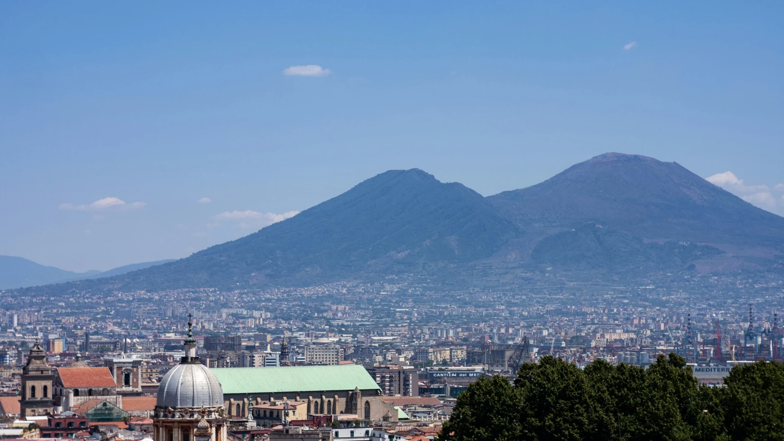 Napoli city skyline with Mount Vesuvius - book car hire in Napoli with no deposit