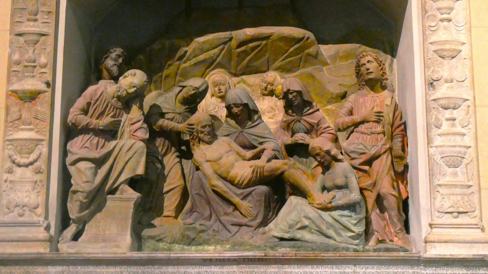 A statue of a group of people in a cave near Duomo di Santa Maria Napoli